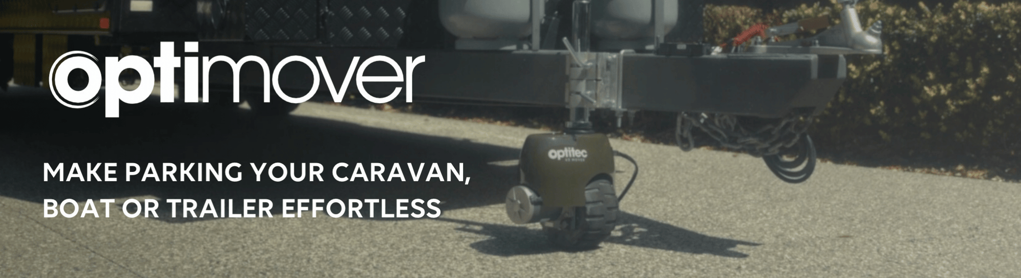 OptiMover caravan mover positioned under a caravan, demonstrating easy and effortless parking for caravans, boats and trailers.